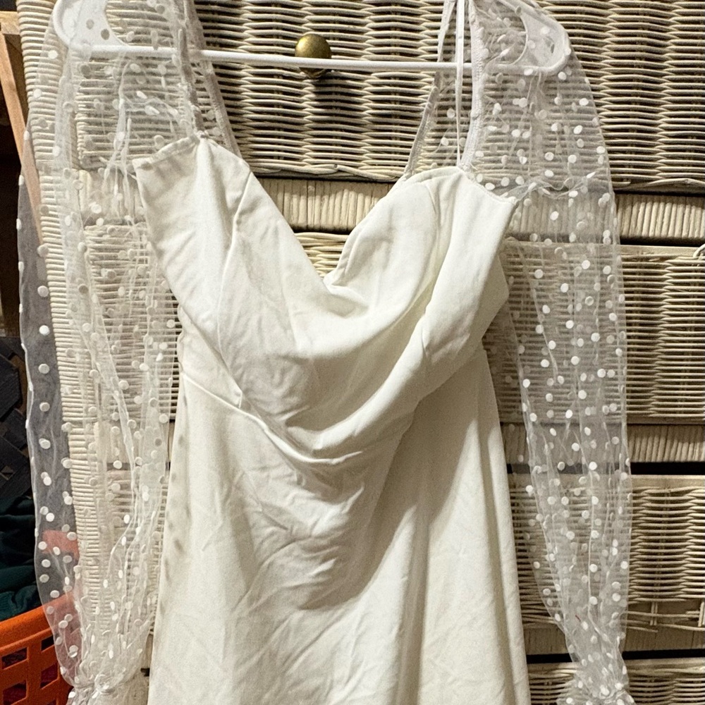 Elegant White Dress with Sheer Polka Dot Sleeves